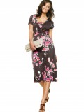 girl in short dress printed purse standing in style
